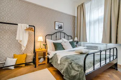 a bedroom with a bed and a window at Florenc Apartments Prague 1 by Michal&Friends in Prague