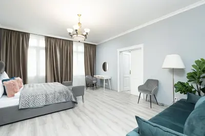 a bedroom with a bed and a living room at Luxury Central 150m2 Apartment on Wencelas Square with Private Garage in Prague