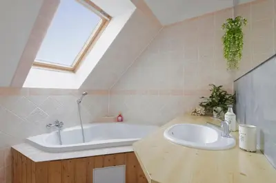 a bathroom with a sink and a bath tub at Guest House KRISTI in Tuchoměřice