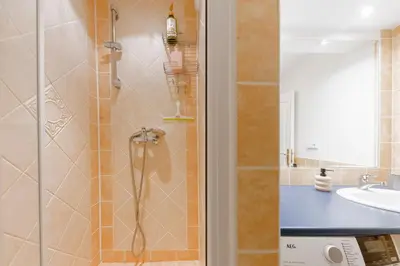 a bathroom with a shower and a sink at Guest House KRISTI in Tuchoměřice