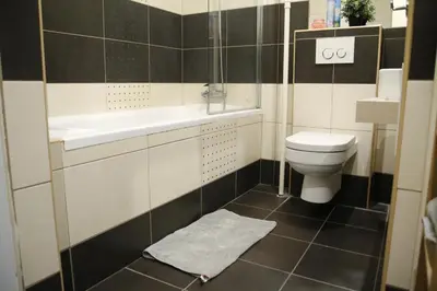 a bathroom with a sink and a toilet at Heart of Old Town Apartment by National Theater in Prague