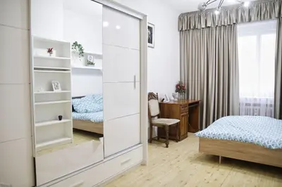 a bedroom with a mirror and a bed and a desk at Heart of Old Town Apartment by National Theater in Prague
