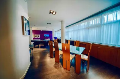 a dining room with a glass table and chairs at Miami Lovely romantic Garden apartment with whirlpool in Prague