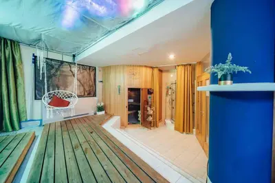a large living room with a blue ceiling at Unique apartment with private pool, cinema, SPA in Prague