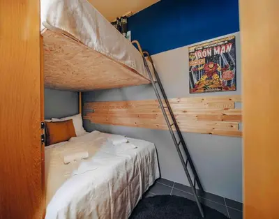 a bedroom with a bunk bed in a room at Unique apartment with private pool, cinema, SPA in Prague