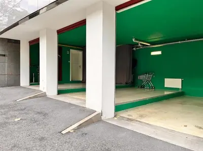 an empty room with a green wall in a building at Lovely 3BD - Rooftop - Jacuzzi&Sauna in Prague