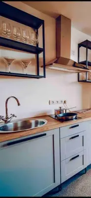 a kitchen with a sink and a counter top at Lovely 3BD - Rooftop - Jacuzzi&Sauna in Prague