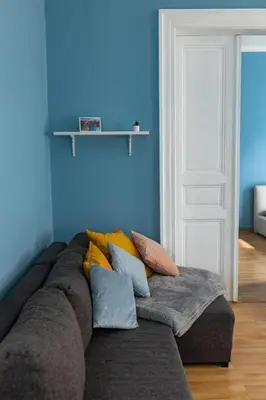 a living room with a couch with pillows on it at I.P.Pavlova in Prague