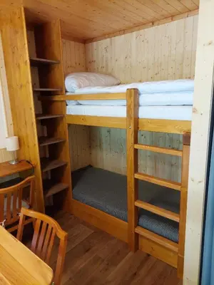 a room with two bunk beds in a cabin at ZÁTOKA Živohošť - Chaty in Chotilsko