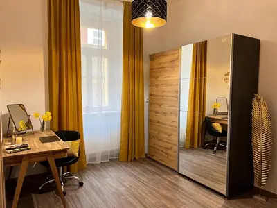 an office with a desk and a large sliding door at PRAGUE’s HIDDEN PEARL in Prague