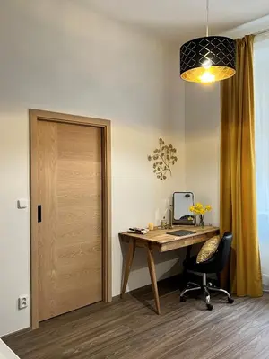 an office with a desk with a chair and a mirror at PRAGUE’s HIDDEN PEARL in Prague