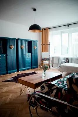 a living room with a table and a couch at Kiki & Luky family apartment by Prague Castle in Prague