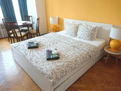 a bedroom with a bed with two plates on it at Cozy studio in the heart of old Prague near the Charles Bridge in Prague