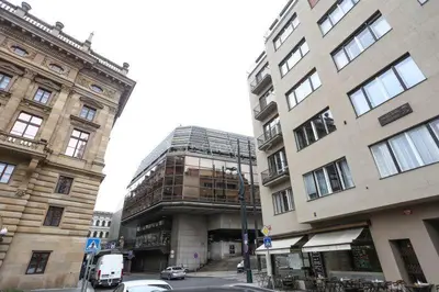 a large building next to two tall buildings at Cozy studio in the heart of old Prague near the Charles Bridge in Prague