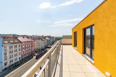 a balcony with a view of a city at Penthouse # 81 with panoramic city view in Elite Rezidence with free parking in Prague