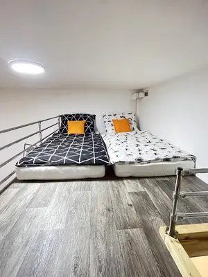 a table with plates and wine glasses on it at VIT Apartment - Free Parking - O2 Arena in Prague