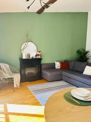 a living room with a couch and a table at Black Pearl by Vysehrad Castle in Prague