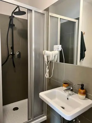 a bathroom with a sink and a shower at Black Pearl by Vysehrad Castle in Prague