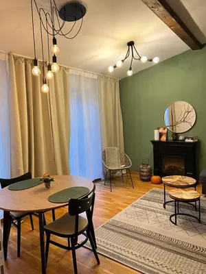 a dining room with a table and chairs at Black Pearl by Vysehrad Castle in Prague