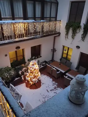 a building with a courtyard with a bunch of furniture at Old Prague House in Prague
