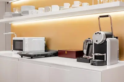 a kitchen with a coffee maker on a counter at Prague Days - City Central One-bedroom Apartment right next to Old Town Square in Prague