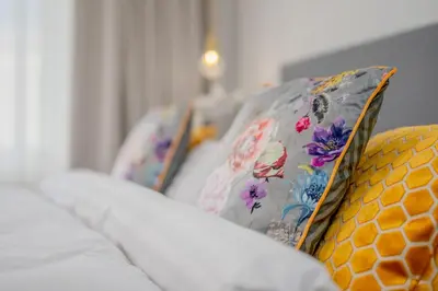 a row of pillows sitting on a couch at Prague Days - City Central One-bedroom Apartment right next to Old Town Square in Prague
