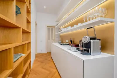 a kitchen with a counter with a sewing machine on it at Prague Days - City Central One-bedroom Apartment right next to Old Town Square in Prague