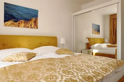 a bedroom with a large bed with two pillows at Apartmá v srdci Poděbrad in Poděbrady