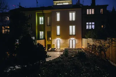 a building with lights on in front of it at Executive Apartments Taborska in Mladá Boleslav