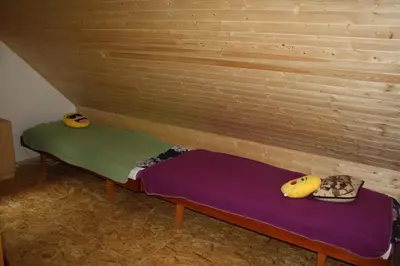 a room with a bench with two bananas on it at Chata na řece Sázavě in Samopše