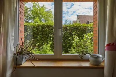 a window with a view of a garden at Villa In Bio Garden - You Will Save Money Here in Prague