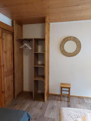 a room with a bed and a mirror on the wall at ZÁTOKA Živohošť - Apartmány in Chotilsko