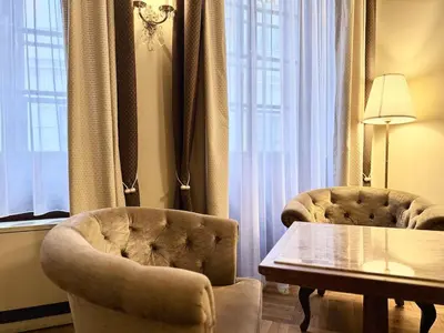 a bedroom with a bed with white pillows at Traditional Prague Apartment in Prague