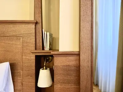 a kitchen with wooden cabinets and a coffee maker on the counter at Traditional Prague Apartment in Prague
