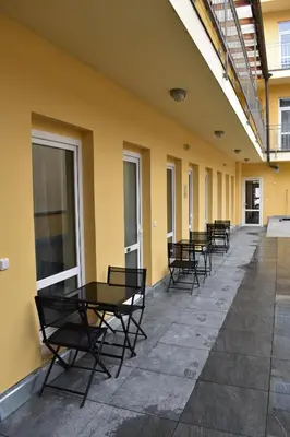 a row of tables and chairs on a building at Seifert Residence in Prague
