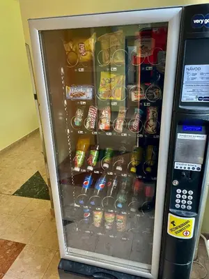 a vending machine filled with drinks and soda at Apartmány Bryksova in Prague
