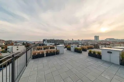 a balcony with a view of a city at Charming apartment for two in uptown in Prague