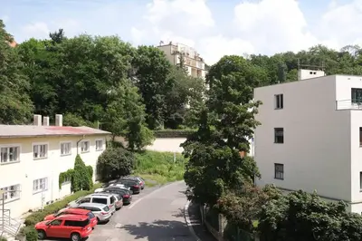 a row of cars parked in a parking lot at Charming apartment for two in uptown in Prague