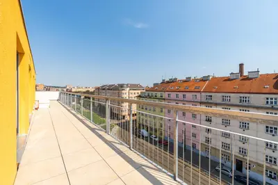 a view from the balcony of a building at One bedroom penthouse apartment # 82 in the brand new building close to the city center with free parking in Prague