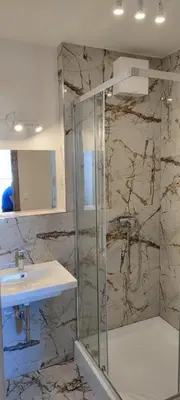 a bathroom with a shower and a sink at One bedroom penthouse apartment # 82 in the brand new building close to the city center with free parking in Prague