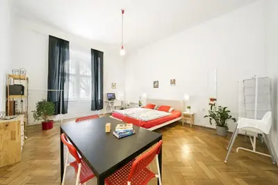 a living room with a bed and a table at LIKE AT HOME IN CENTER OF PRAGUE in Prague