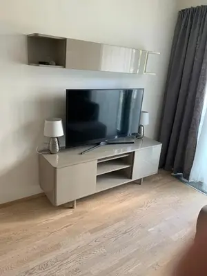 a flat screen tv sitting on a entertainment center at Residence Garden Tower - 8 min do centra, garaz in Prague