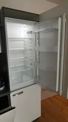 an empty refrigerator with its door open in a room at Residence Garden Tower - 8 min do centra, garaz in Prague