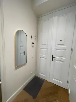 a hallway with a mirror and a door at Luxury apartment in the centre in Prague