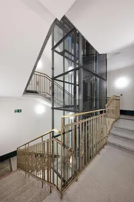 a staircase in a building with a glass wall at Luxury apartment in the centre in Prague