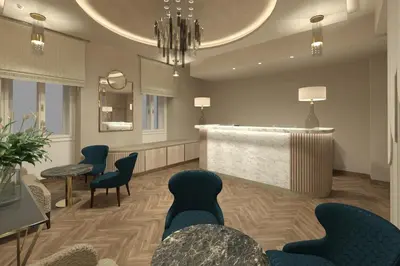 a waiting room with blue chairs and a counter at Allure Hotel & Residence Prague in Prague
