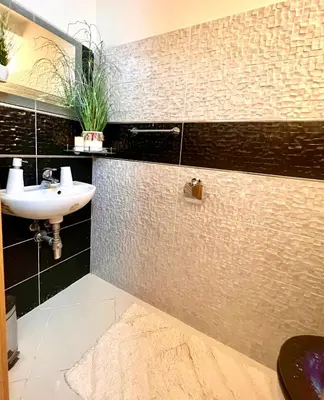 a bathroom with a sink and a mirror at Duplex 2 with quiet terrace on Wenceslas Square in Prague