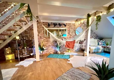 a room with a hammock and a brick wall at Duplex 2 with quiet terrace on Wenceslas Square in Prague