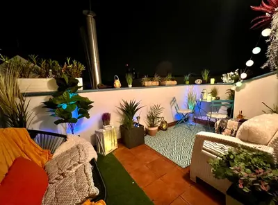 a patio with a bunch of potted plants at Duplex 2 with quiet terrace on Wenceslas Square in Prague