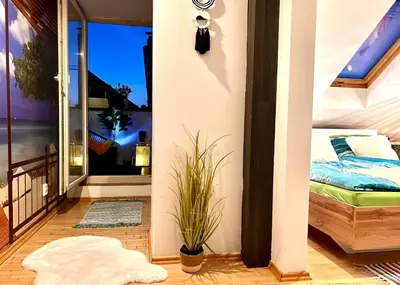 a room with a balcony with a bed and a window at Duplex 2 with quiet terrace on Wenceslas Square in Prague